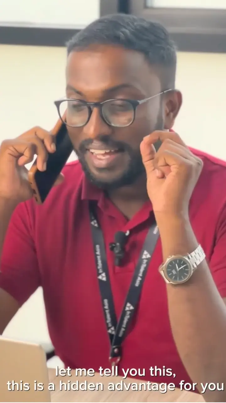 Mayantha in a red polo shirt speaking on the phone, for In Talent Asia